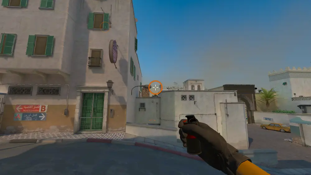 Standing on the T Spawn Railing spot on Dust2, the aim mark on the point this smoke is thrown at.