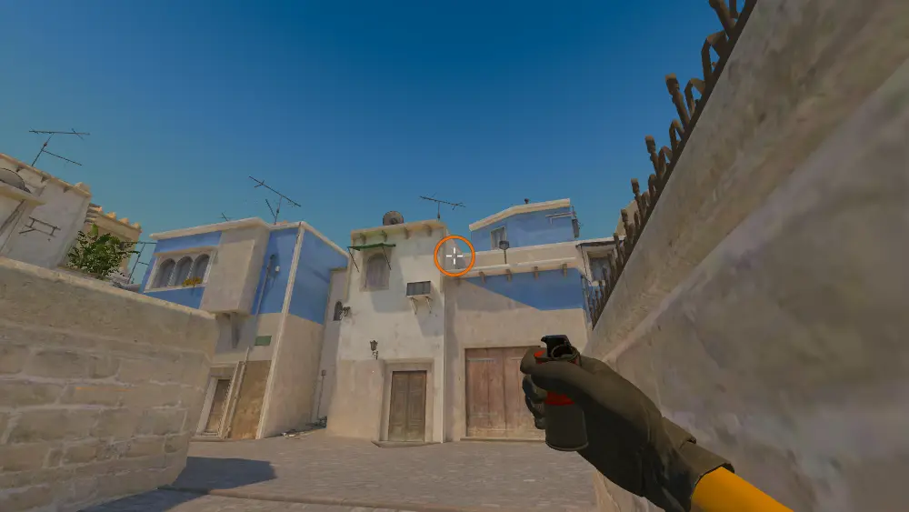 Standing on the CT Spawn spot on Mirage, the aim mark on the point this smoke is thrown at.