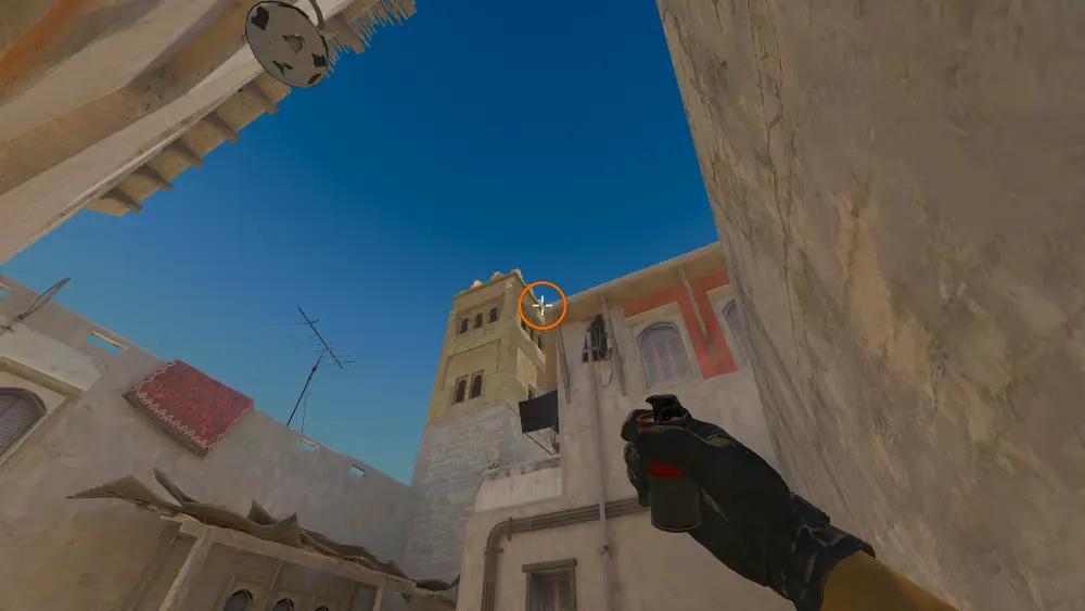 Standing on the T House spot on Mirage, the aim mark on the point this smoke is thrown at.