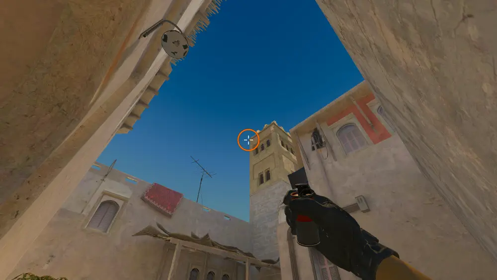 Standing on the Back Alley spot on Mirage, the aim mark on the point this smoke is thrown at.
