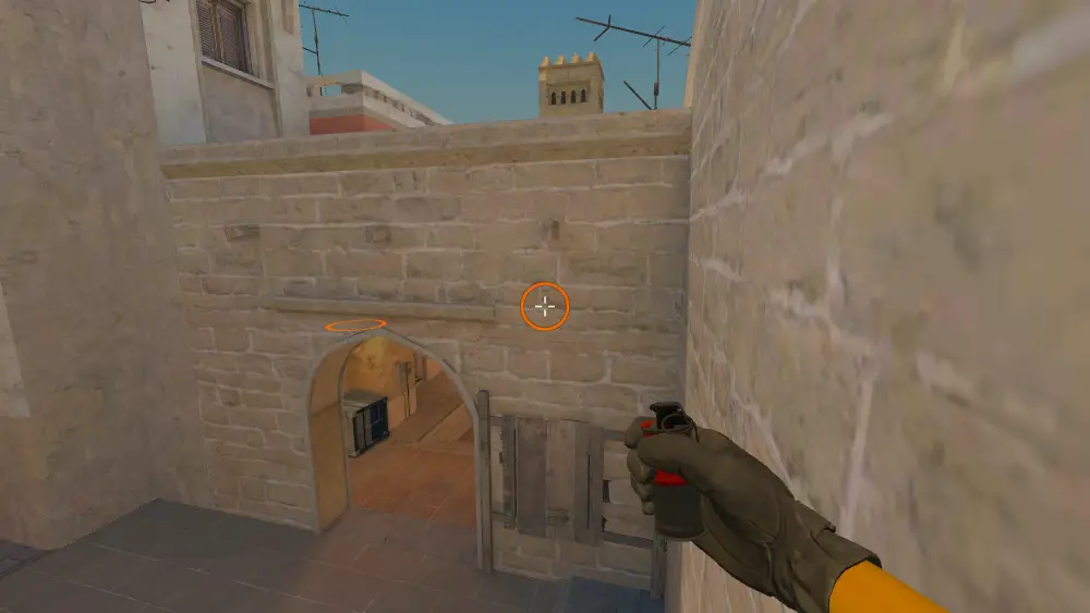 Standing on the A Stairs spot on Mirage, the aim mark on the point this molotov is thrown at.