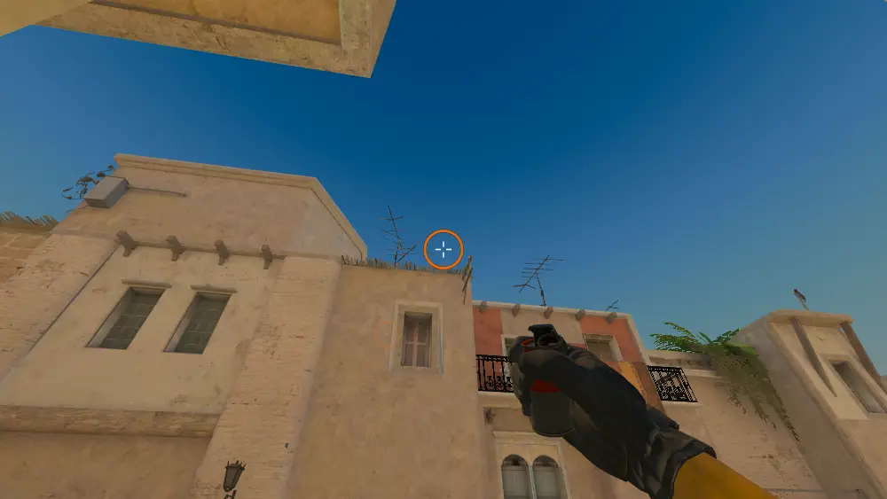 Standing on the T Spawn spot on Mirage, the aim mark on the point this smoke is thrown at.