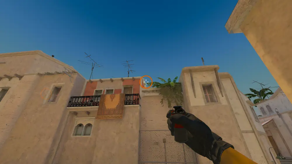 Standing on the T Spawn spot on Mirage, the aim mark on the point this smoke is thrown at.