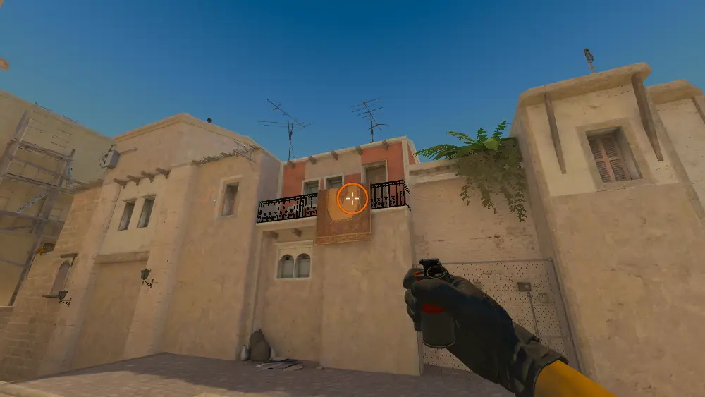 Standing on the T Spawn spot on Mirage, the aim mark on the point this smoke is thrown at.