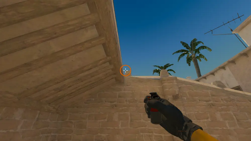Standing on the T Roof spot on Mirage, the aim mark on the point this smoke is thrown at.