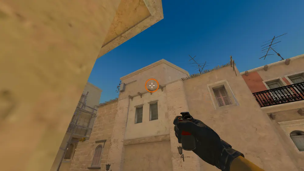Standing on the T Spawn spot on Mirage, the aim mark on the point this smoke is thrown at.