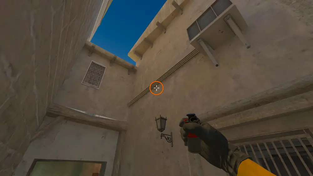Standing on the Back Alley spot on Mirage, the aim mark on the point this smoke is thrown at.