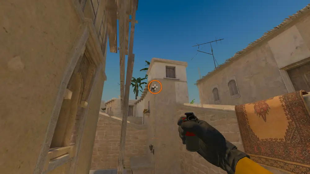 Standing on the T Roof spot on Mirage, the aim mark on the point this smoke is thrown at.
