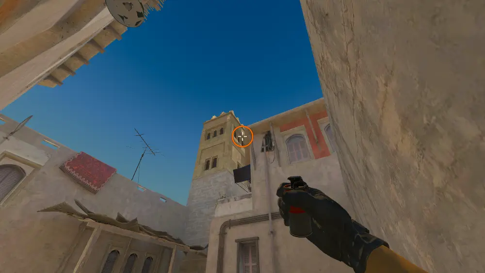 Standing on the Back Alley spot on Mirage, the aim mark on the point this smoke is thrown at.