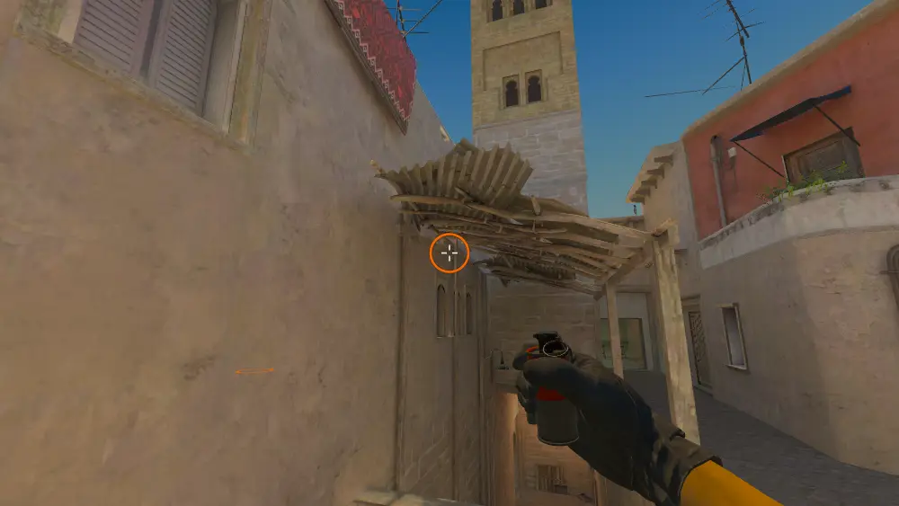 Standing on the Back Alley spot on Mirage, the aim mark on the point this smoke is thrown at.