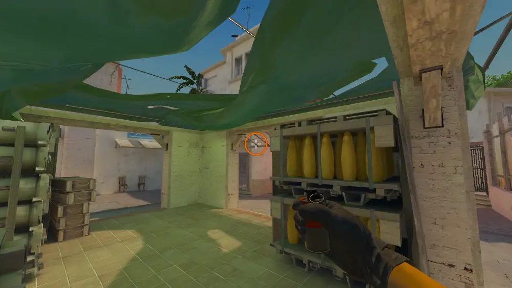 Standing on the Default spot on Mirage, the aim mark on the point this smoke is thrown at.