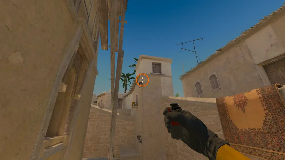 Standing on the T Roof spot on Mirage, the aim mark on the point this smoke is thrown at.