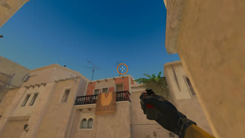 Standing on the T Spawn spot on Mirage, the aim mark on the point this smoke is thrown at.