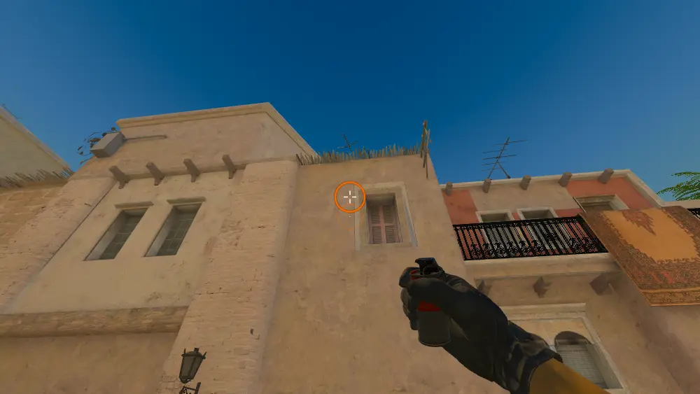 Standing on the T Spawn spot on Mirage, the aim mark on the point this smoke is thrown at.