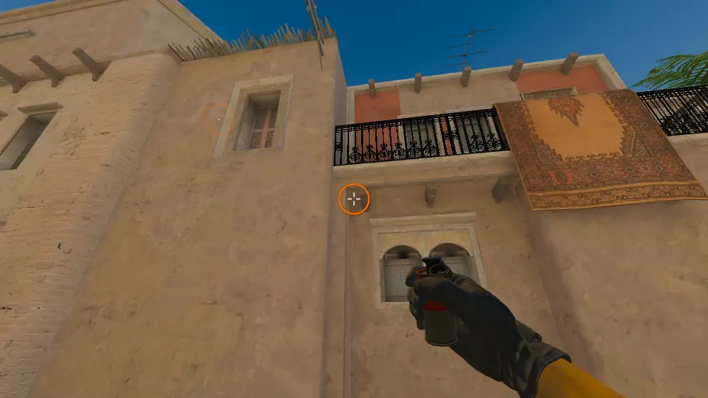 Standing on the T Spawn spot on Mirage, the aim mark on the point this smoke is thrown at.