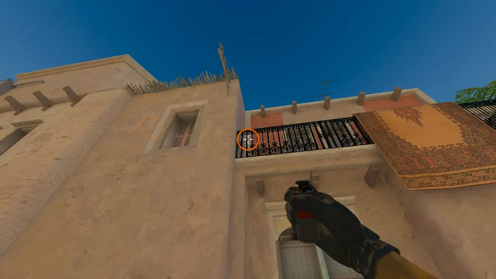 Standing on the T Spawn spot on Mirage, the aim mark on the point this smoke is thrown at.