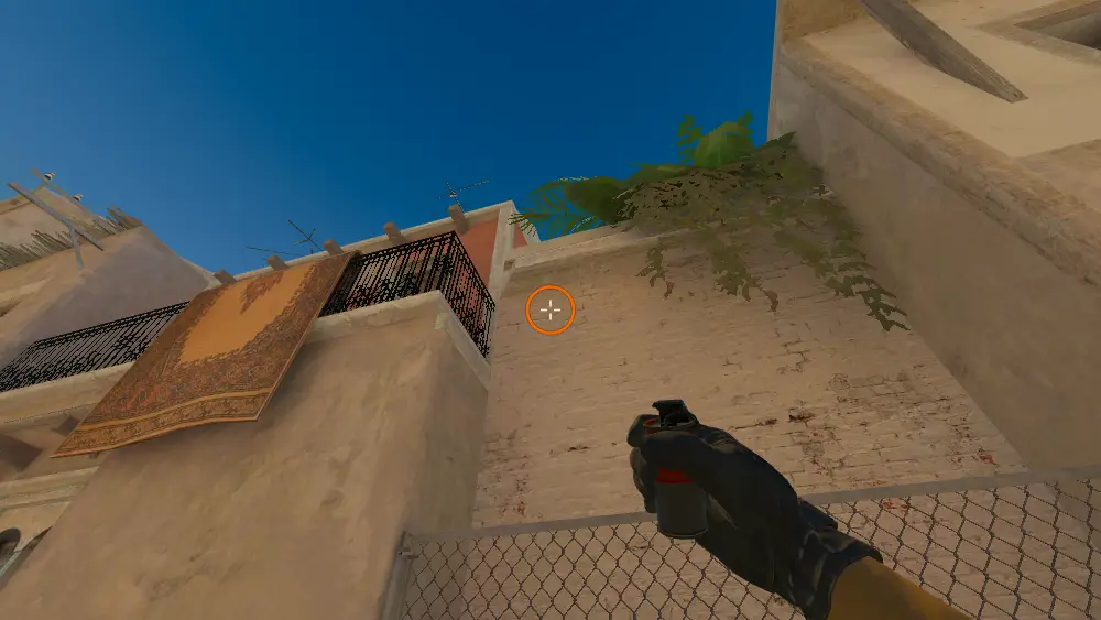 Standing on the T Spawn spot on Mirage, the aim mark on the point this smoke is thrown at.