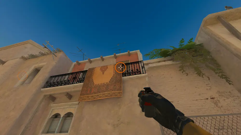 Standing on the T Spawn spot on Mirage, the aim mark on the point this smoke is thrown at.