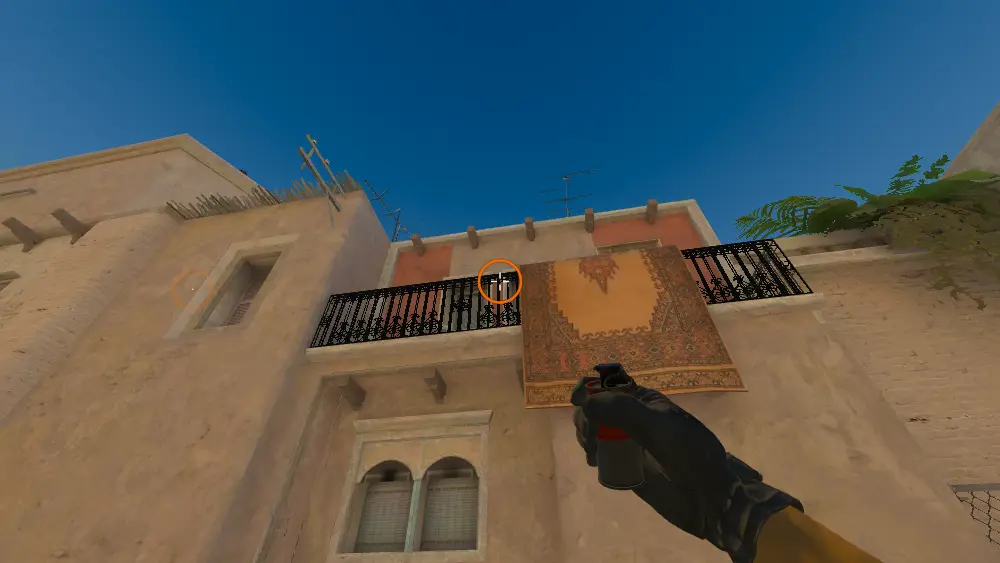Standing on the T Spawn spot on Mirage, the aim mark on the point this smoke is thrown at.