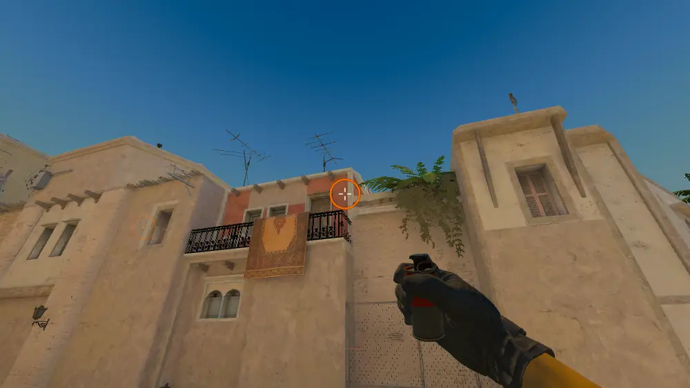 Standing on the T Spawn spot on Mirage, the aim mark on the point this smoke is thrown at.