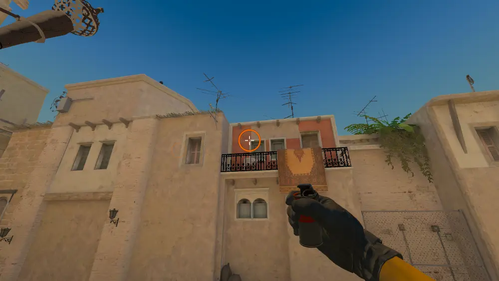Standing on the T Spawn spot on Mirage, the aim mark on the point this smoke is thrown at.