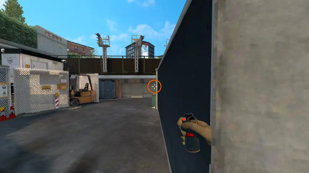 Standing on the Back Alley spot on Overpass, the aim mark on the point this smoke is thrown at.